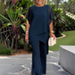 Conjunto encantador de blusa irregular e calça pantalona